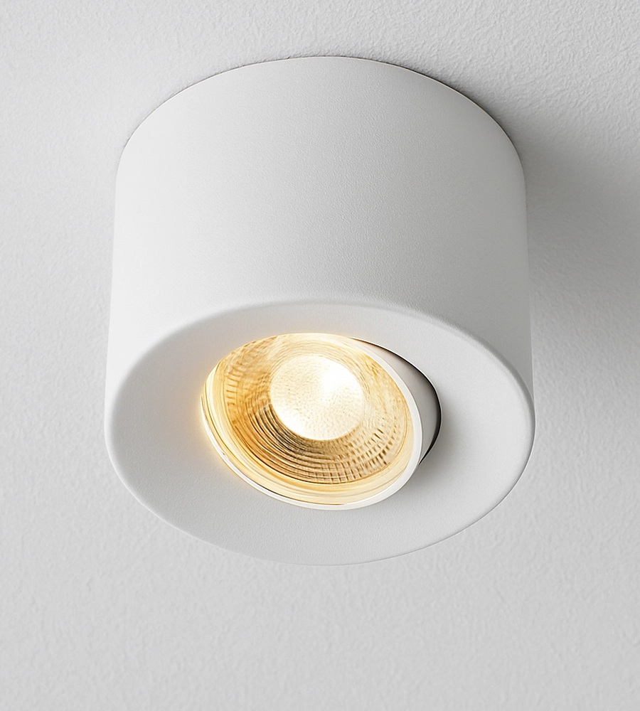 Witte opbouwspot met licht aan